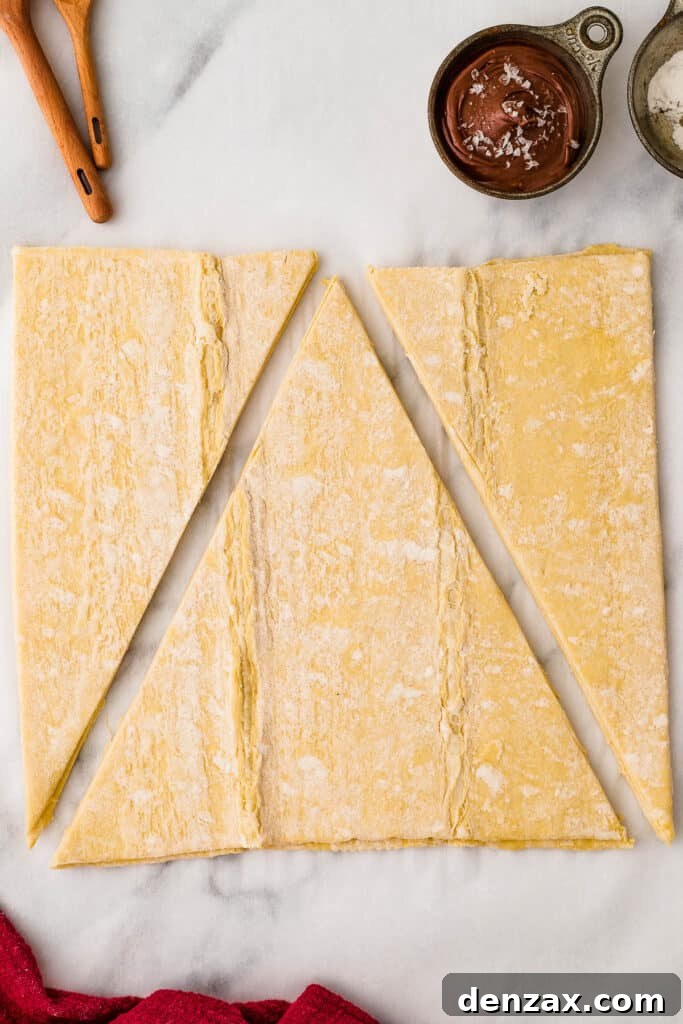 puff pastry sheet cut into 3 pieces to shape it into a christmas tree.