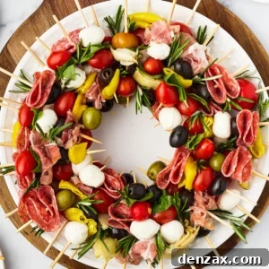 A table with a cutting board holding a wreath of skewers, a small pair of scissors, and fresh rosemary sprigs.