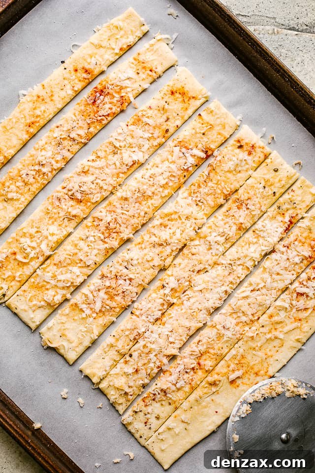 Puff pastry layered with spices and cheese, then sliced.
