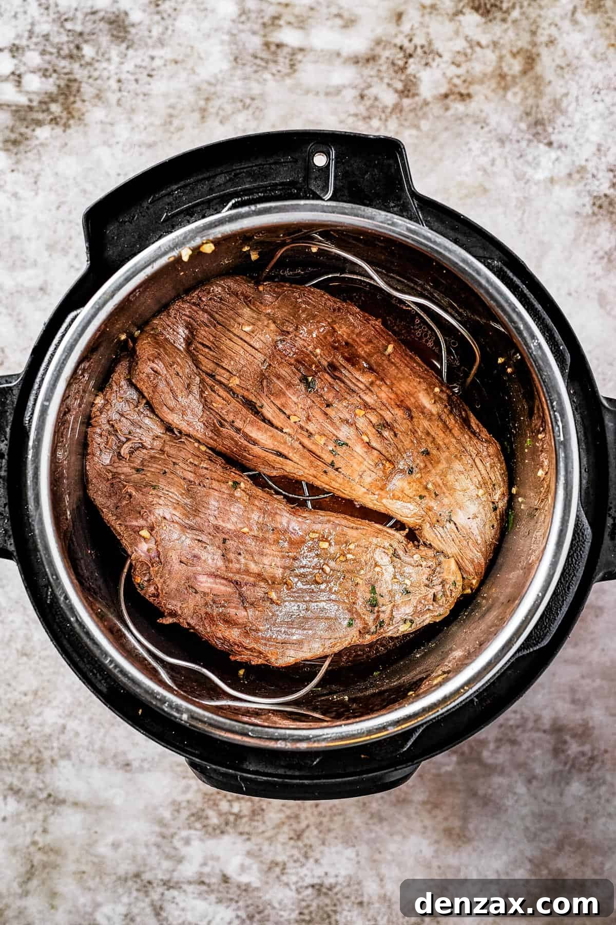 Flank steak browning in an Instant Pot.