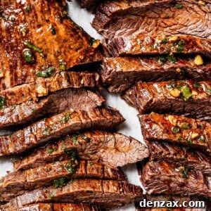 Sliced cooked steak on a cutting board.
