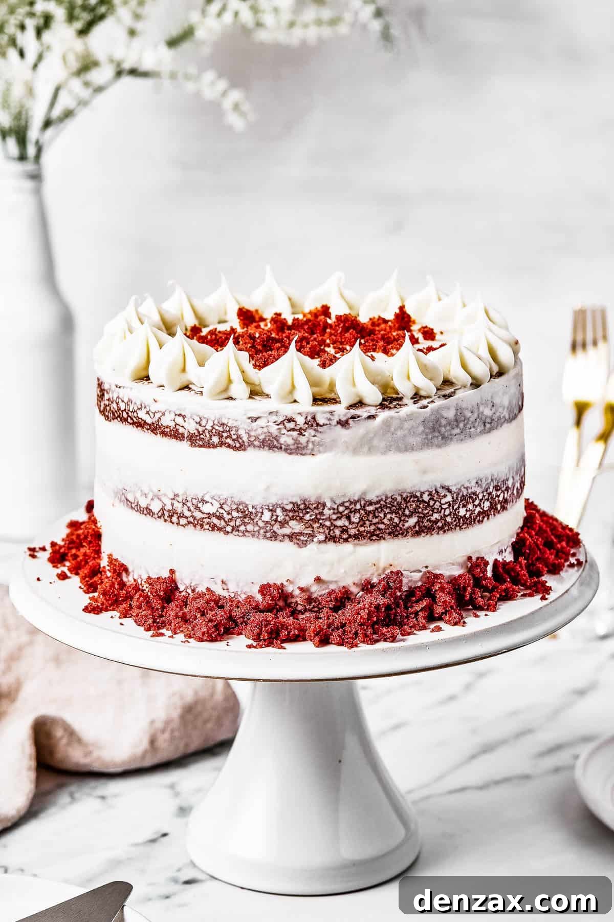 A red velvet cake on a cake stand.