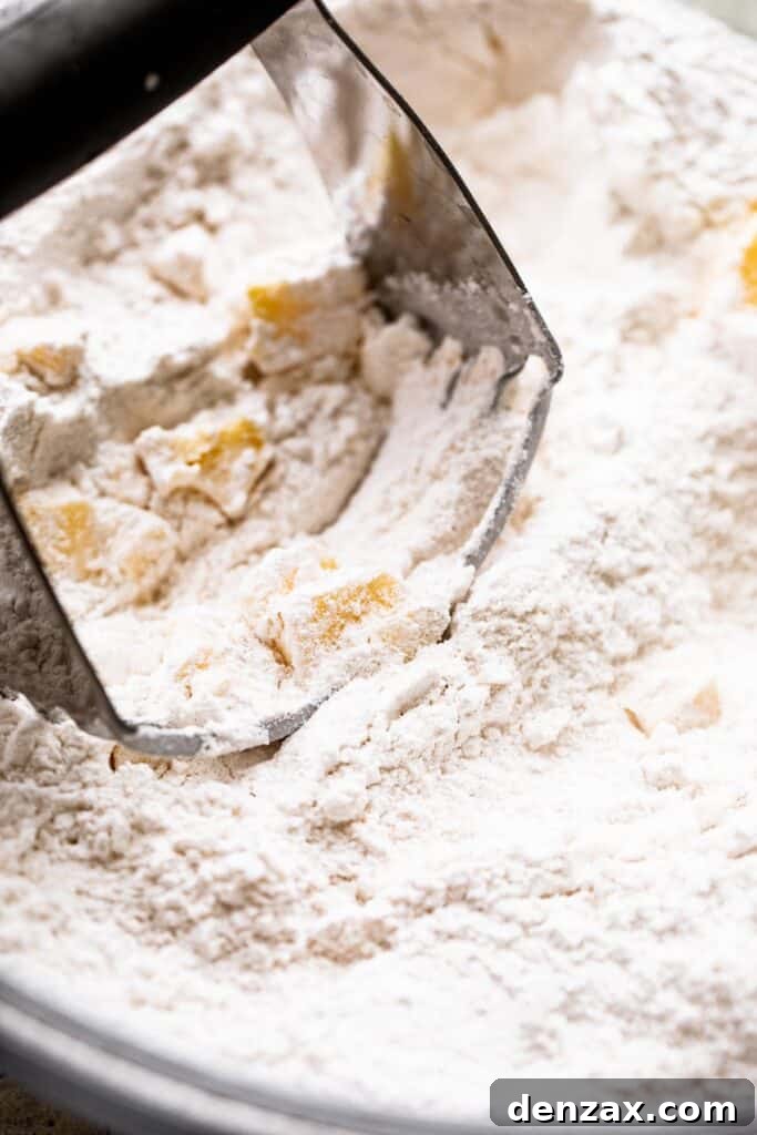 cutting butter into flour with a pastry blender.