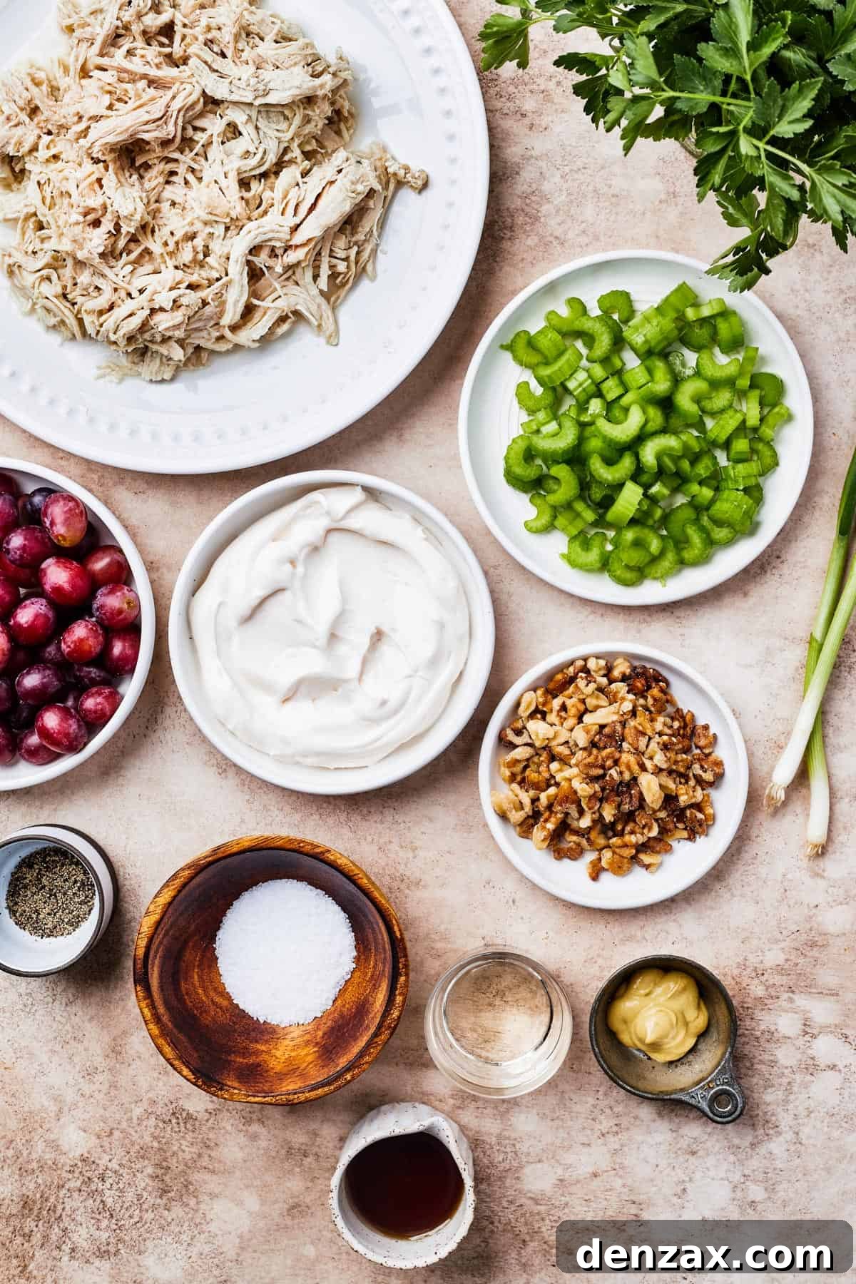 From top left: Shredded chicken, celery grapes, mayonnaise, chopped walnuts, seasonings, white wine vinegar, dijon mustard, maple syrup