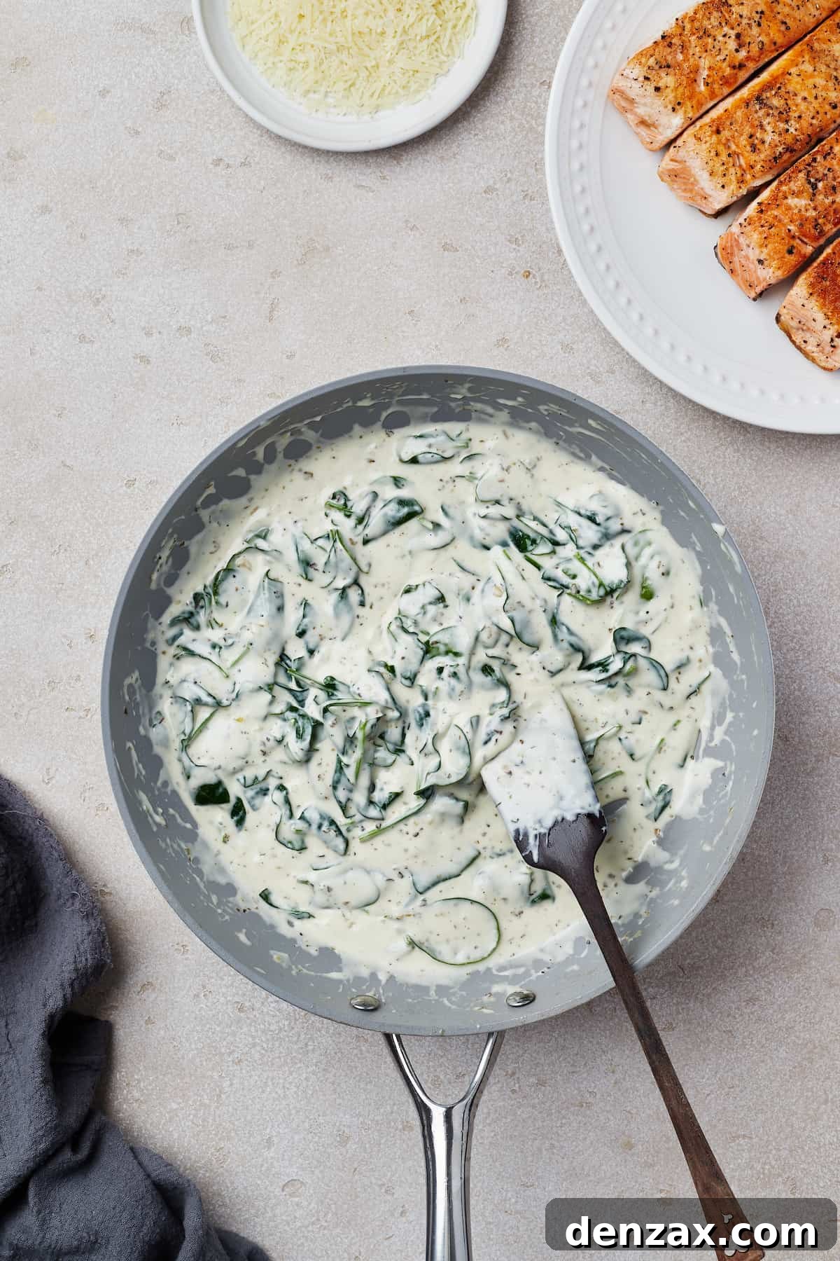 A creamy spinach sauce in a nonstick skillet.