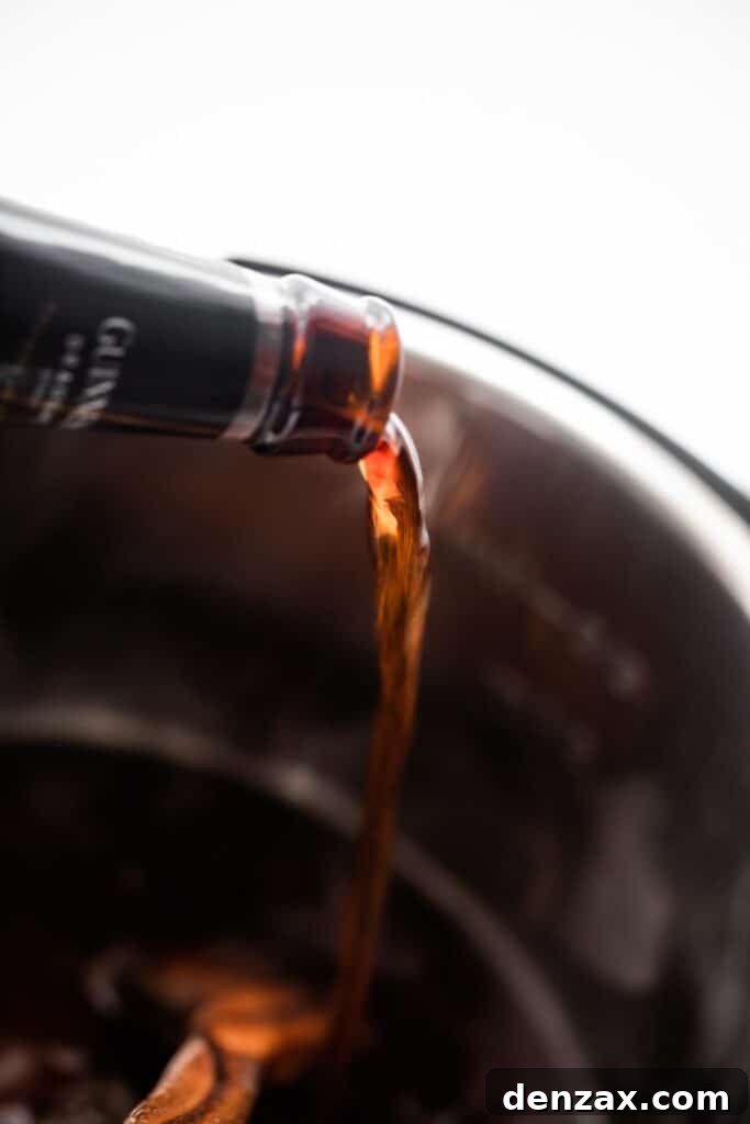 pouring Guinness beer into the insert of an instant pot.