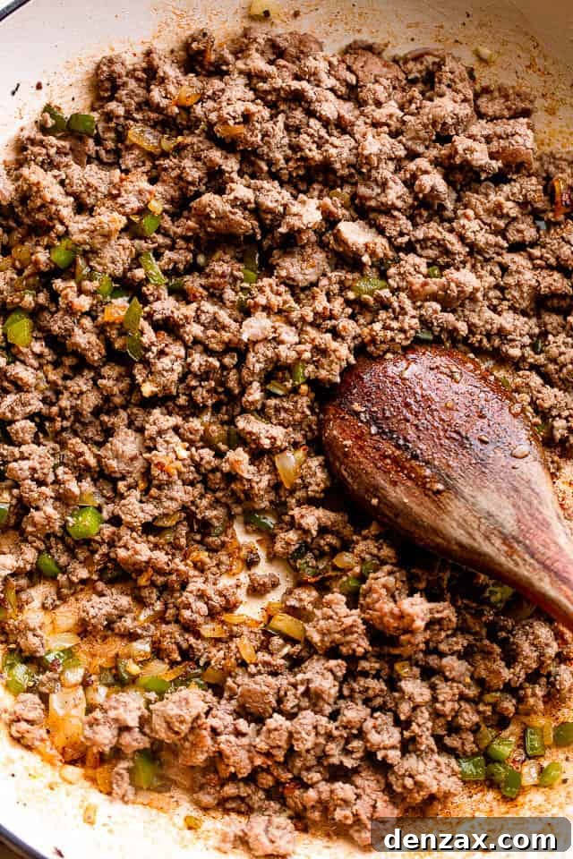 Browning ground beef in a skillet.