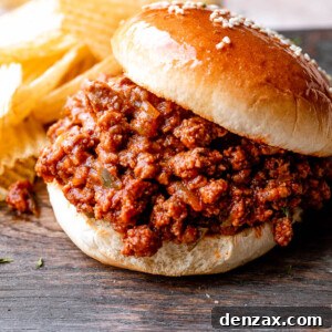 sloppy joe hamburger placed on a wooden board