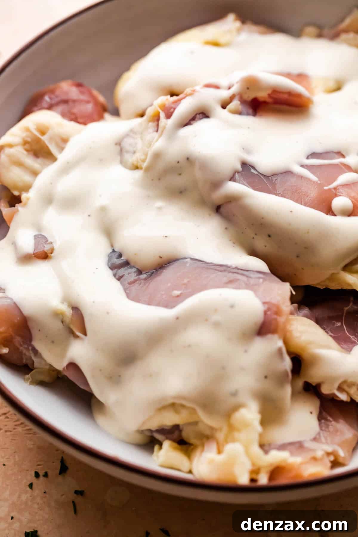 raw chicken thighs marinating in ranch dressing.