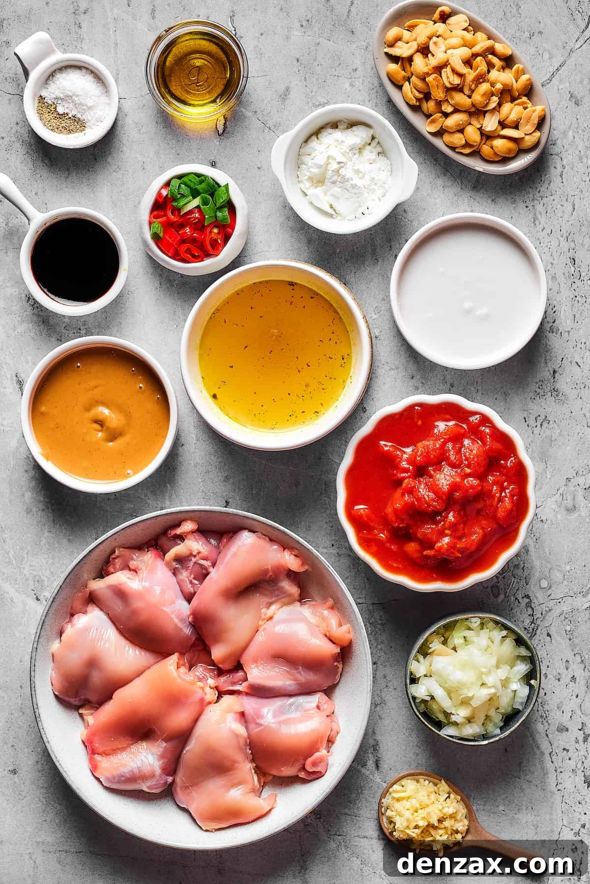From top left: Salt, olive oil, roasted peanuts, soy sauce, sliced chilies and green onions, cornstarch, peanut butter, chicken stock, coconut milk, chicken thighs, crushed tomatoes, chopped onion, garlic.