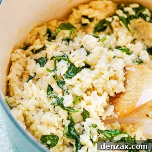 stirring rice and spinach with wooden spoon