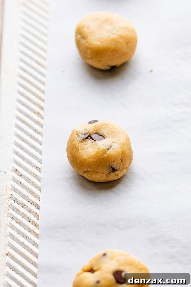 Rolling dough into balls Rolling the cookie dough into balls.