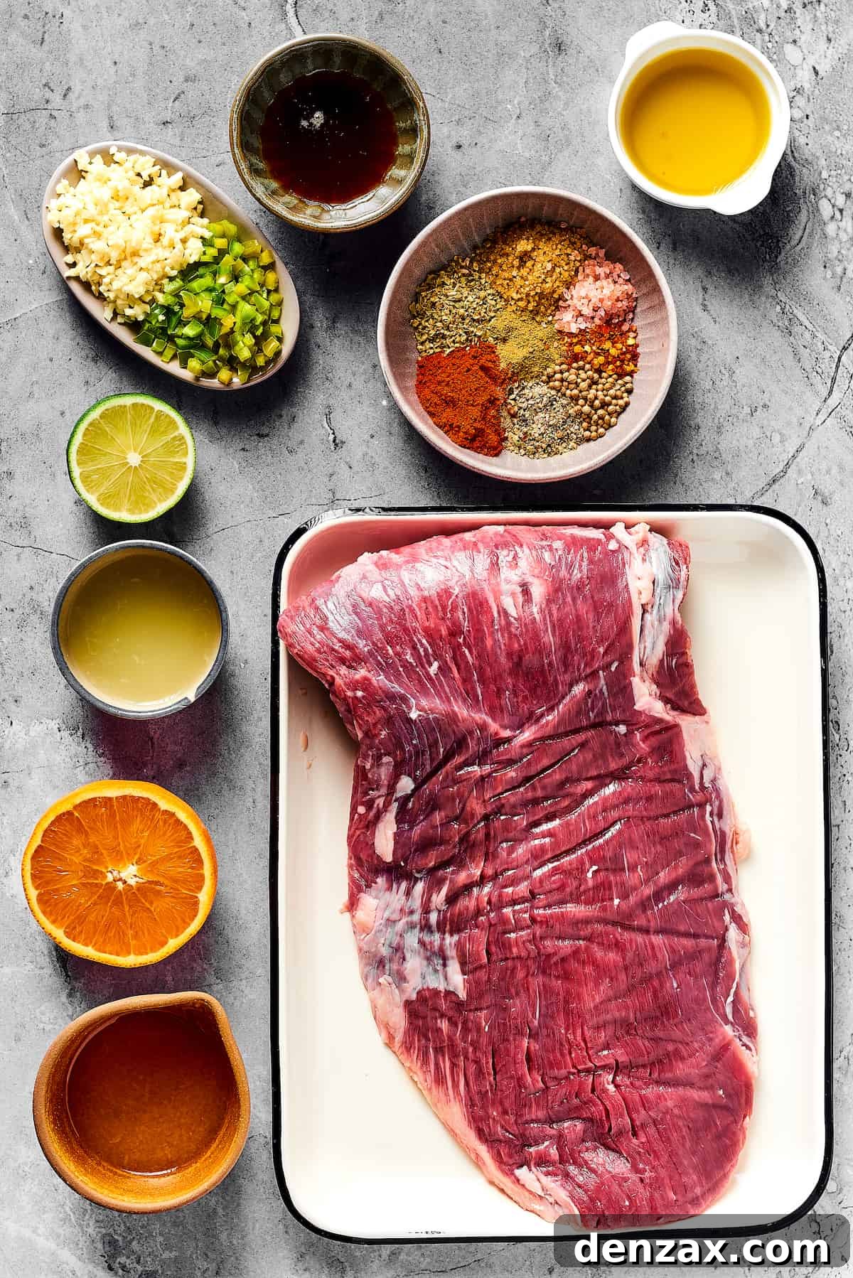 From top left: Minced garlic and jalapeno, maple syrup, spices, olive oil, lime juice, orange juice, flank steak.