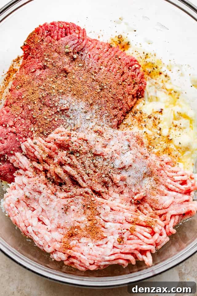 glass bowl filled with ingredients for meatballs