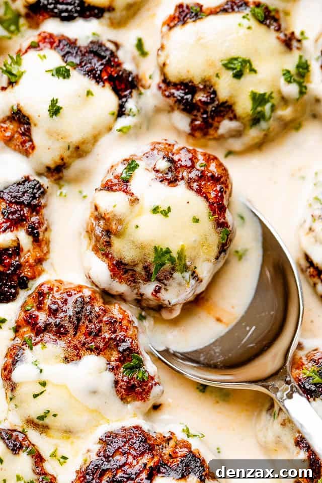 scooping out swedish meatballs drizzled with gravy