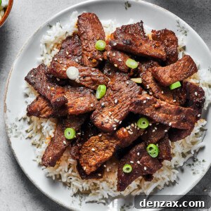 A plate of bulgogi with other dishes visible at the edges of the shot.