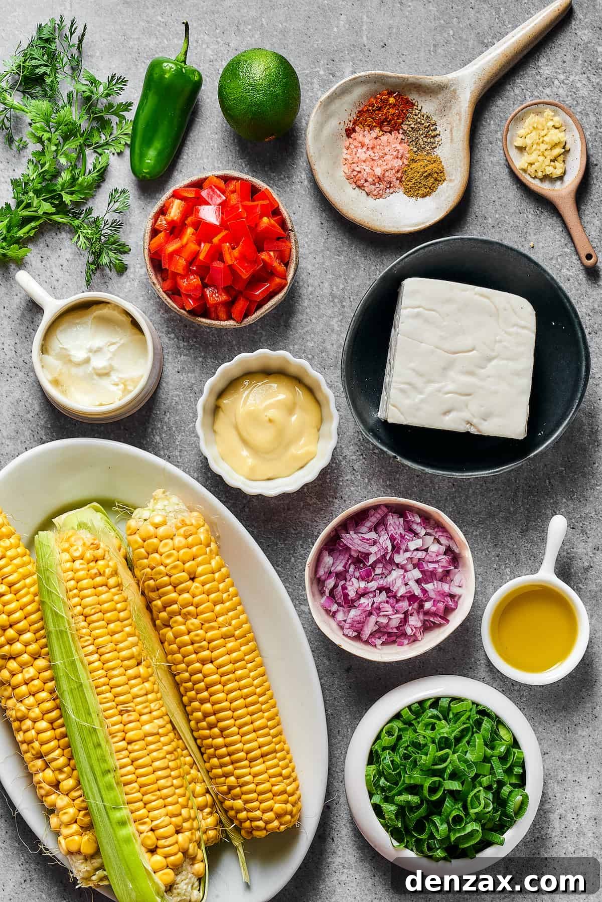 From top left: Cilantro, jalapeno, spices, minced garlic, sour cream, red bell pepper, mayonnaise, goat cheese, fresh corn, red onion, olive oil, chopped green onion.
