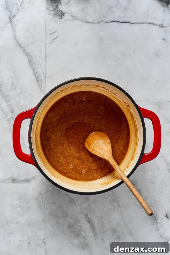 A sugar-syrup mixture in a saucepan.