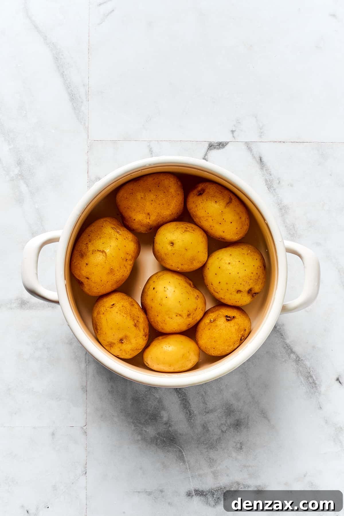 Potatoes cooking in a pot.