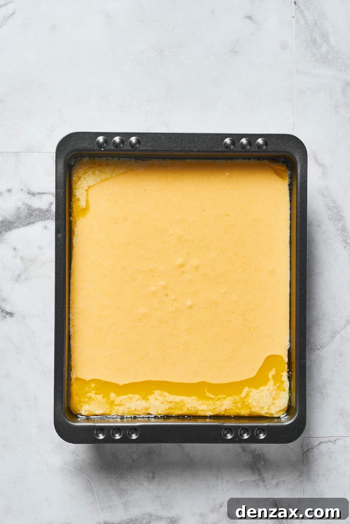 Cornmeal batter in a baking pan.