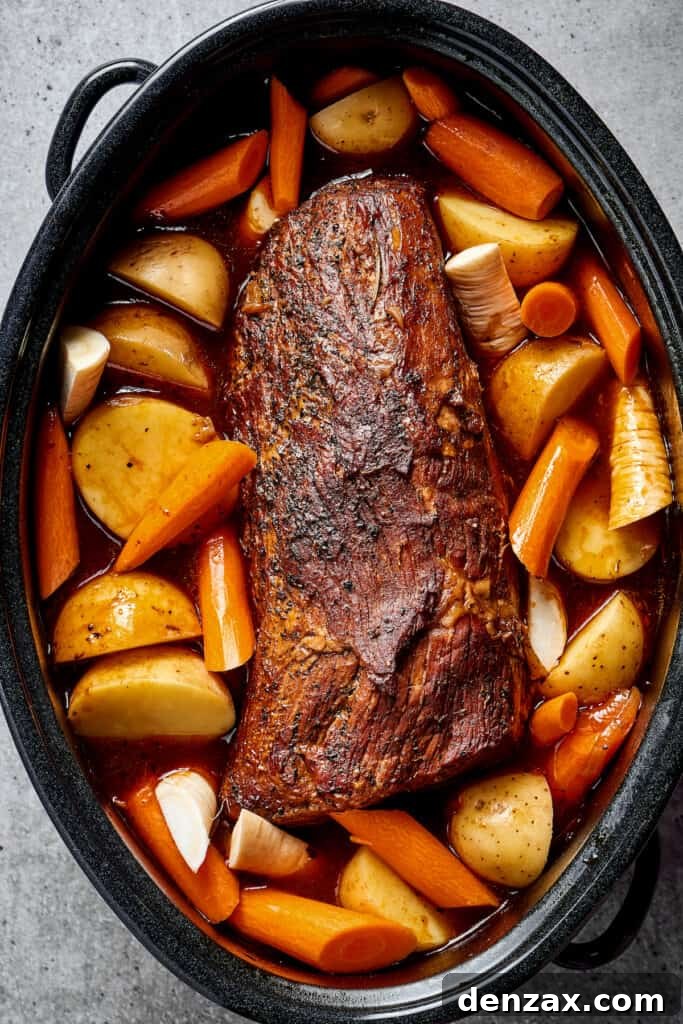 Pot roast with vegetables in a Dutch oven.