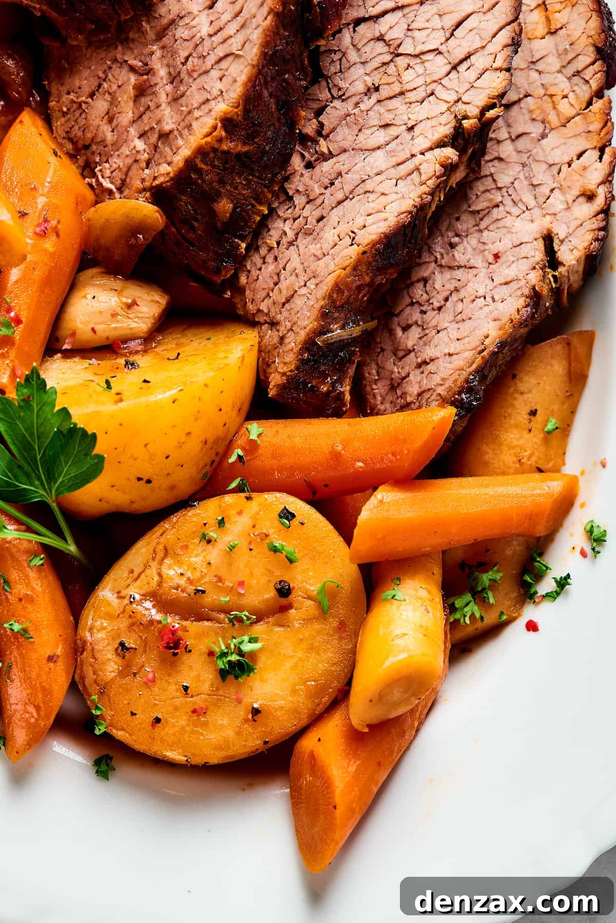 Close-up shot of pot roast and vegetables.