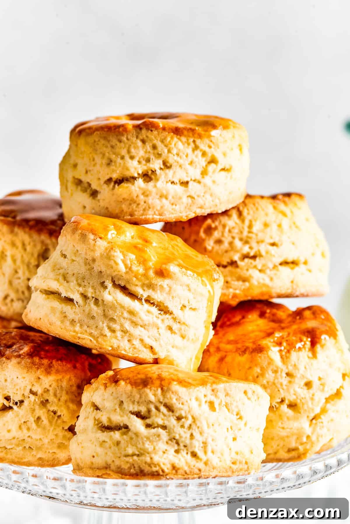Six biscuits, stacked in a pyramid shape on a cake plate.