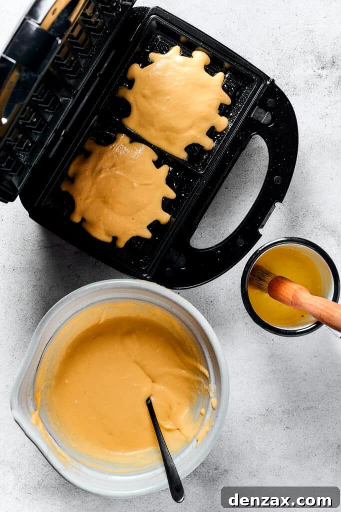 Crispy Homemade Waffles: Simple Recipe for Fluffy Breakfast 5 Making waffles in a waffle iron.