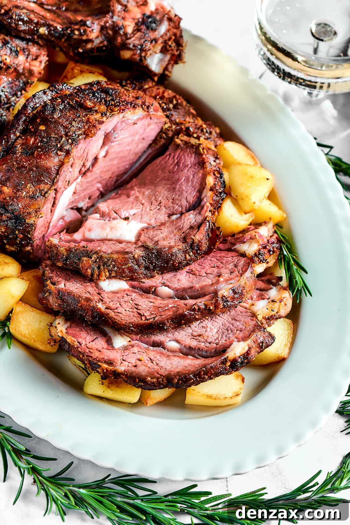 A sliced prime rib roast on a platter.