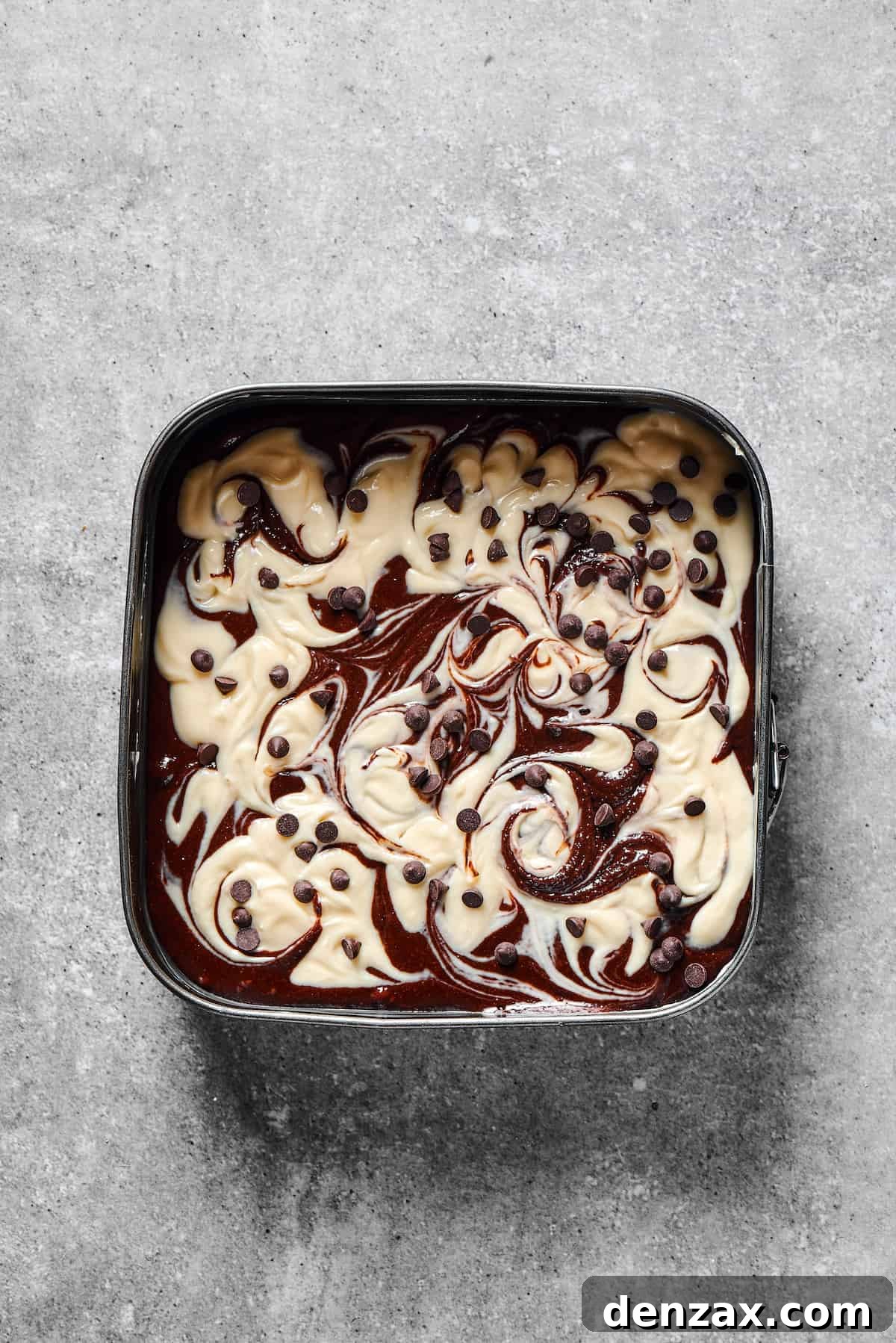 Cream Cheese Brownies Recipe: Fudgy Swirl Brownies You’ll Love 4 Cheesecake brownies topped with chocolate chips.