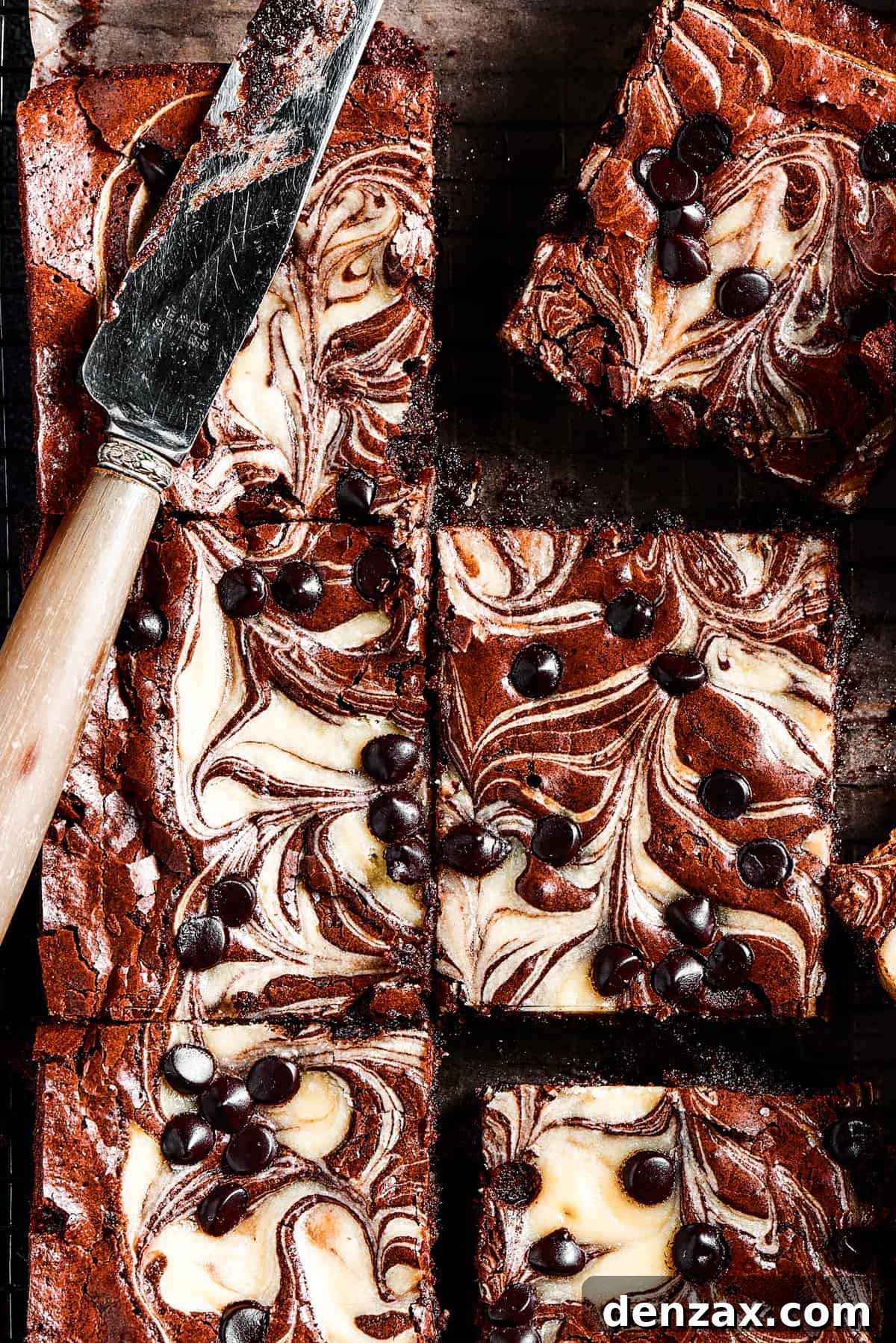 Cream Cheese Brownies Recipe: Fudgy Swirl Brownies You’ll Love 7 overhead shot of cream cheese swirl brownies dotted with chocolate chips.