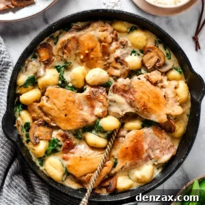 Creamy chicken and gnocchi in a cast-iron skillet.