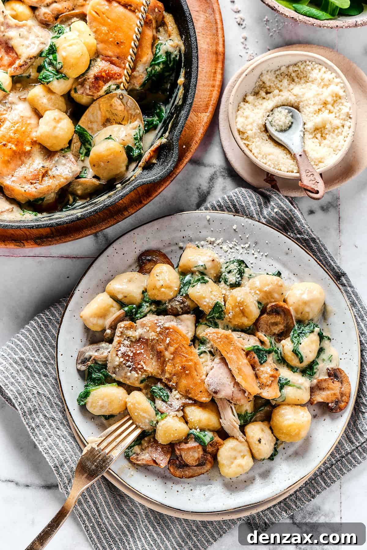 Overhead shot of a chicken skillet dish served onto a dinner plate.