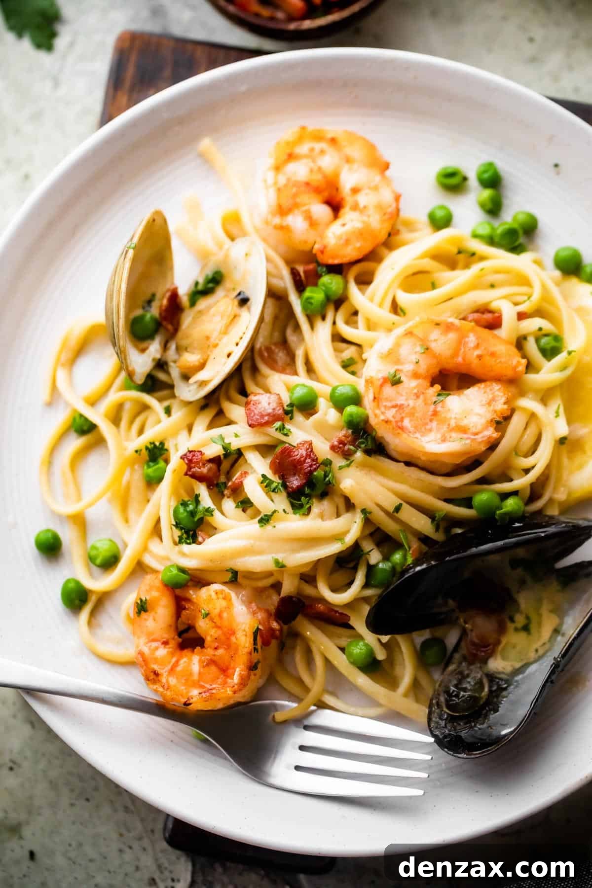 Creamy Seafood Pasta Recipe: Easy, Flavorful Weeknight Dinner 5 overhead shot of a dinner plate with Creamy Pasta with shrimp and mussels.