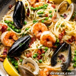 Creamy Seafood Pasta Recipe: Easy, Flavorful Weeknight Dinner 7 a skillet with pasta, shrimp, and mussels in cream sauce.