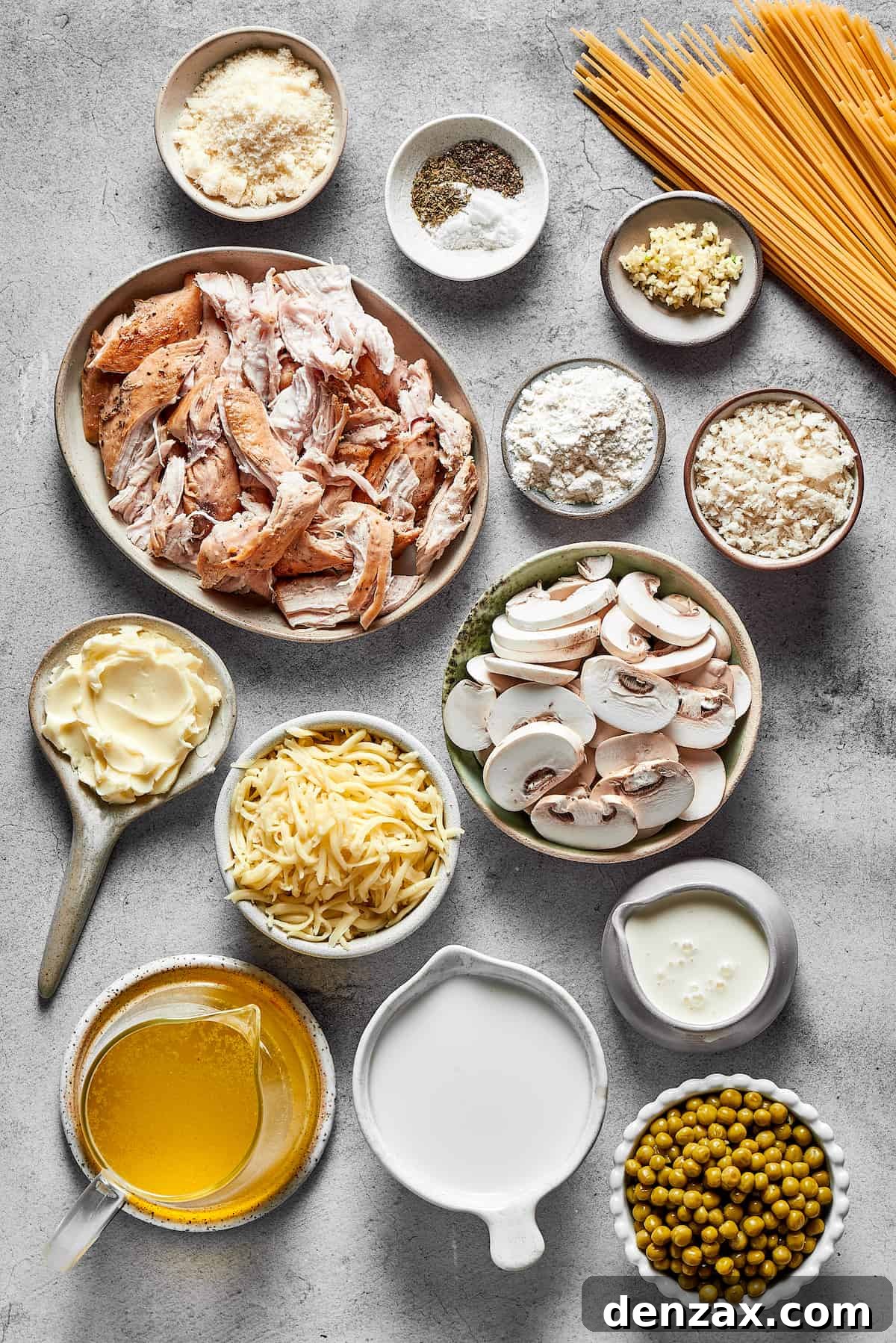 Chicken tetrazzini ingredients measured and arranged on a work surface.