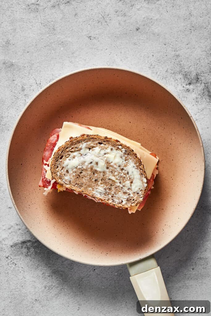 Grilling a Reuben sandwich in a skillet.