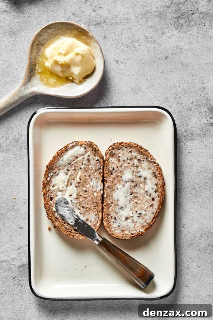 Spreading butter thinly on bread.