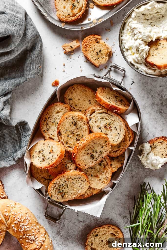 Bagel chips in a small tin lined with parchment paper.