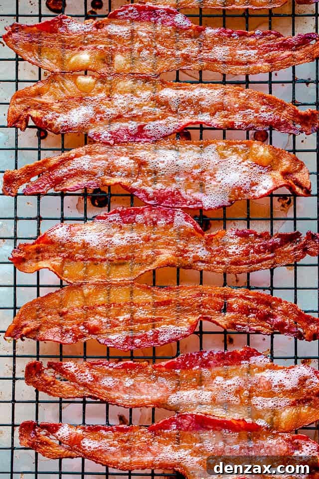 Oven baked bacon on a cooling rack.