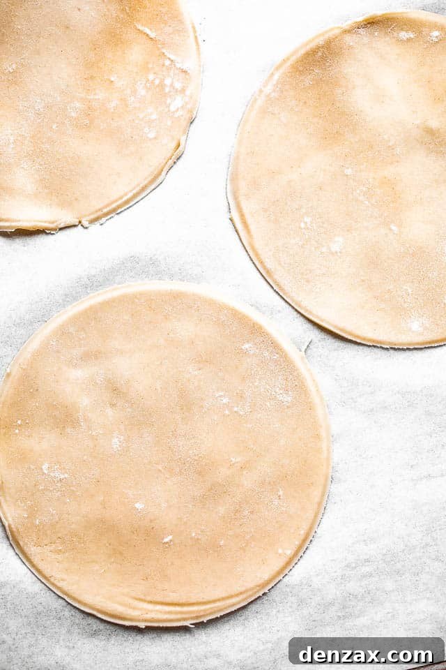 Mini berry galettes are the perfect summer dessert. Fresh berries are baked in a flaky pie crust that’s been dusted with sugar. So good! pie dough cut into small rounds