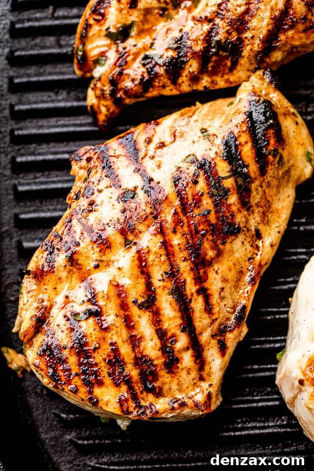 chicken breast with grill marks set on a black grill pan