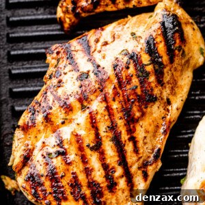 chicken breast with grill marks set on a black grill pan