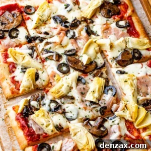 rectangular capricciosa pizza cut into squares