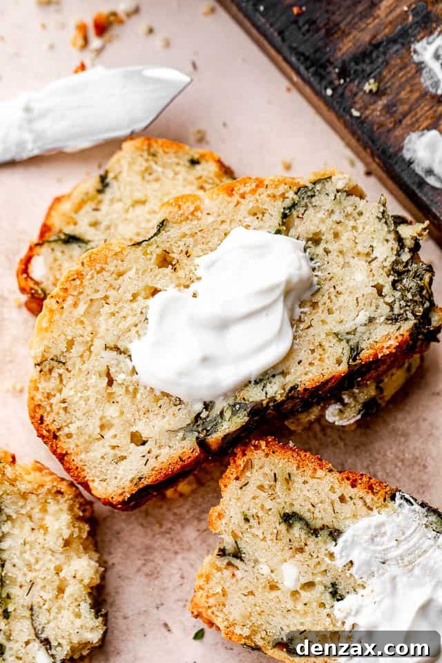 Spinach and Feta Savory No-Yeast Bread Recipe 3 close up shot of spinach and feta cheese no yeast bread slice topped with yogurt
