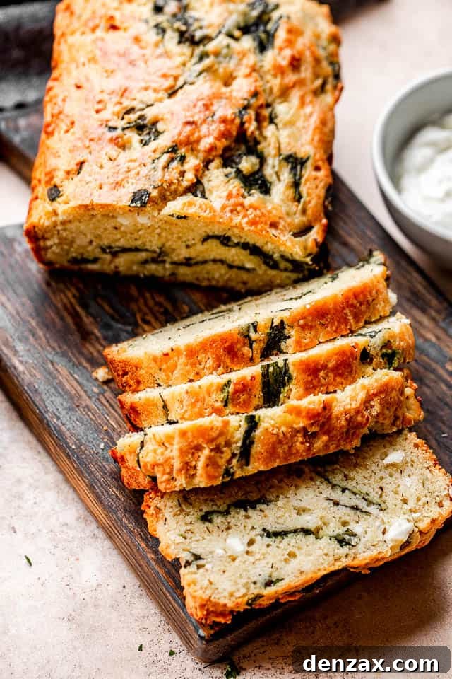 Spinach and Feta Savory No-Yeast Bread Recipe 5 top shot of sliced spinach and feta bread set on top of a dark cutting board