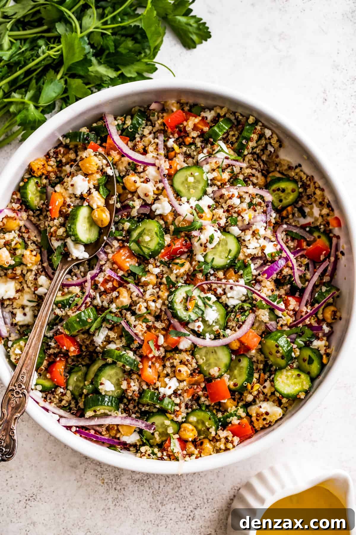 Drizzled with homemade dressing, this Jennifer Aniston quinoa salad with crunchy chickpeas is super light and refreshing. Overhead shot of a big bowl with Jennifer Aniston's bulgur salad.