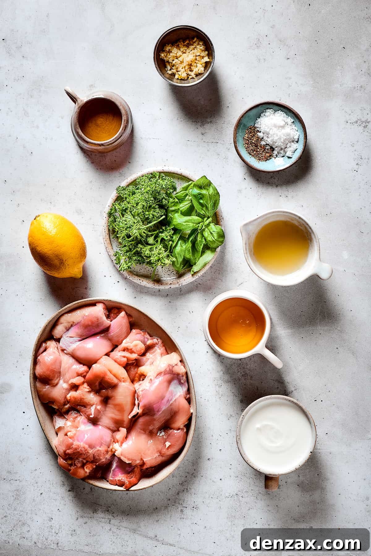 From top: Garlic, salt and pepper, lemon juice, honey, yogurt, chicken thighs, herbs, olive oil.