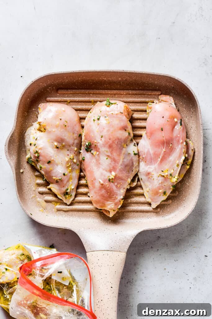 Cooking chicken on a grill pan.