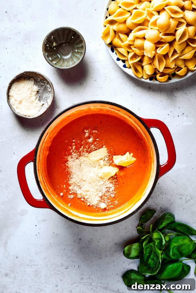 Parmesan added to vodka sauce.